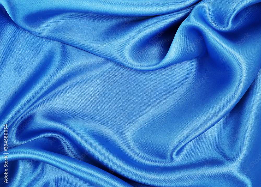 Obraz premium Smooth elegant blue silk or satin luxury cloth texture as abstract background. Luxurious background design