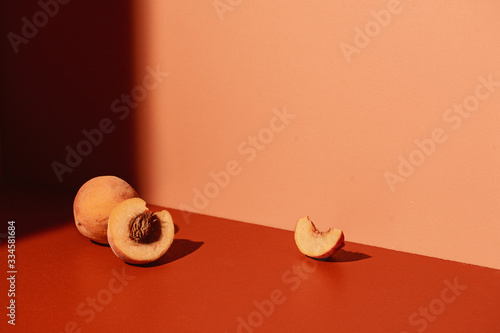 Peaches on Coral Colored Background