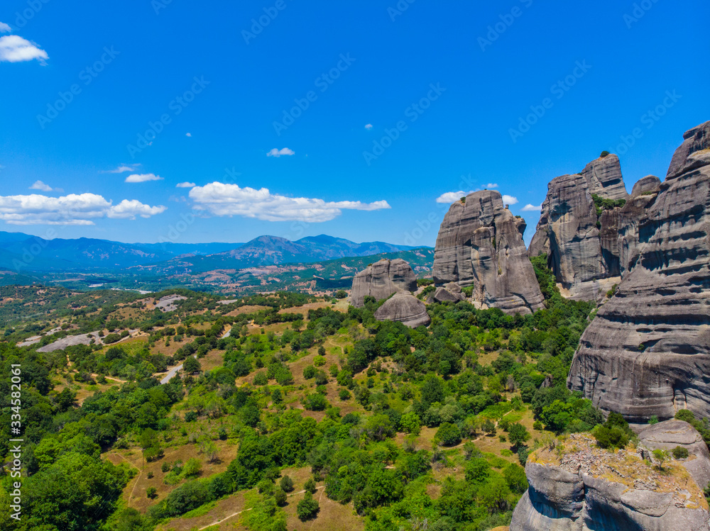 Greece. The historical region of Thessaly. Rocks of Meteora. View of the Thessalian Plain. Popular tourist spot. Drone. Aerial view. The camera moves forward