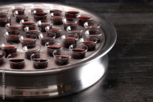 Elements of the Holy Communion or Lords Supper on a Wooden Table photo