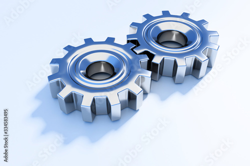 Two connecting metallic gear cogs isolated on white background; close up; perspective view 3d rendering, 3d illustration