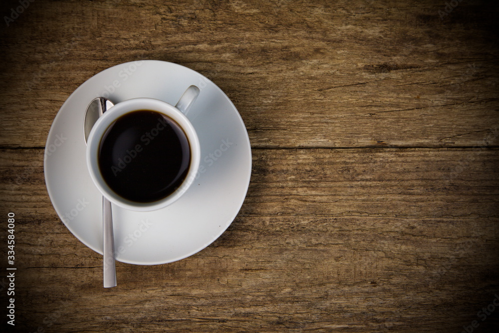 cup of coffee on wooden table cup of coffee on wooden table