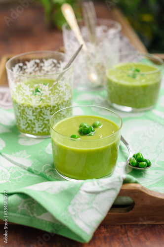Cream of Green Pea Soup Garnished with Fresh Peas