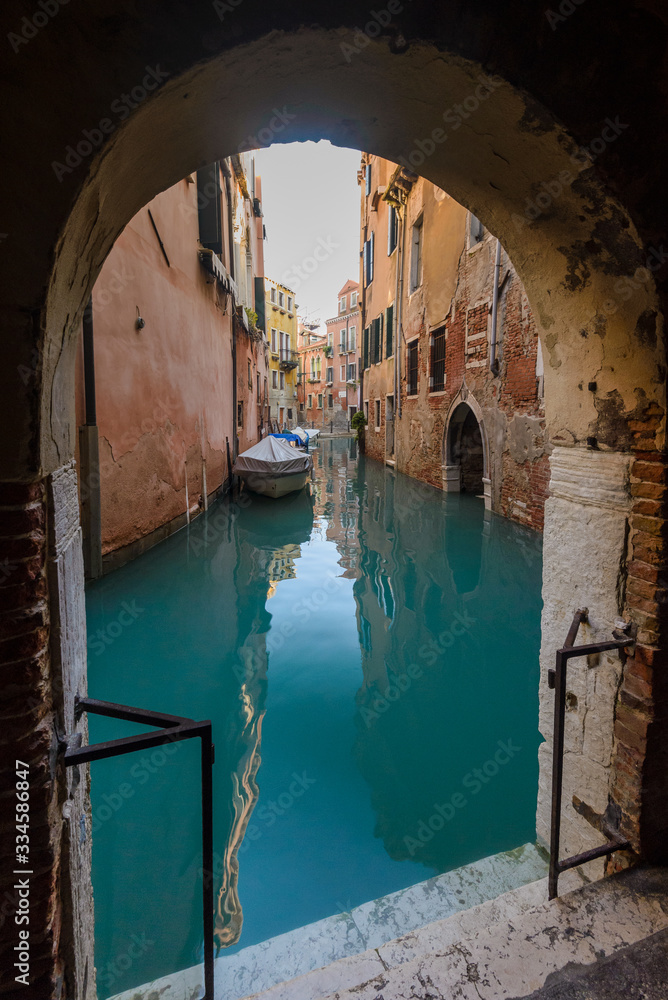 Beautiful venetian canal with turquoise water. Italy.