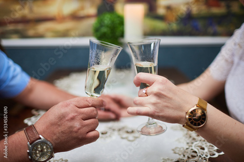 man and woman with glasses of champagne