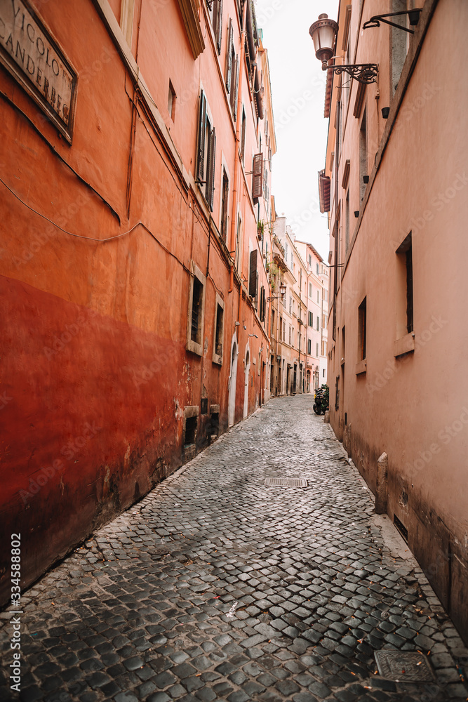 Old beautiful empty narrow streets in small city of Lucca in Italy