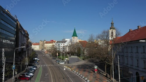 flying above railways on empty SPN square in centre Bratislava, with tram photo