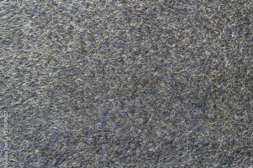 Grey wool fabric background. Amazing texture of warm textile for winter coats.