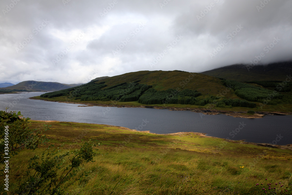Skye Island (Scotland), UK - August 15, 2018: Typical landscape of Scotland, Isle of Skye, Inner Hebrides, Scotland, United Kingdom Skye Island (Scotland), UK - August 15, 2018: Typical landscape of Scotland, Isle of Skye, Inner Hebrides, Scotland, United Kingdom