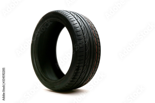 car tire with directional rotation isolated on a white background. new modern low profile car tyre. 