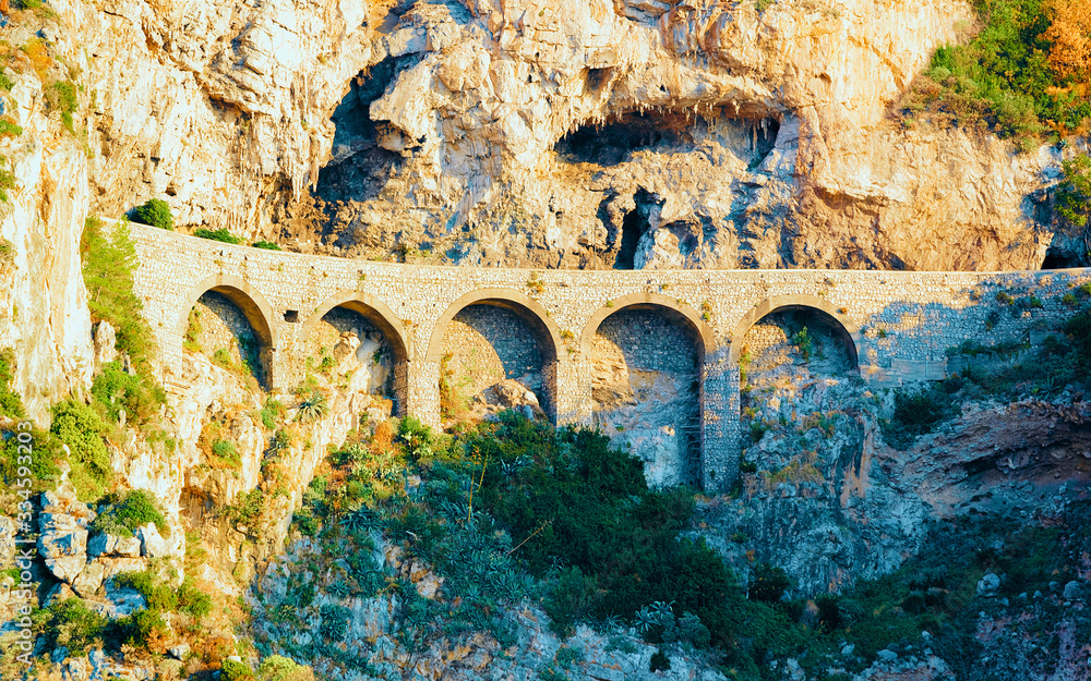 Citiscape and landscape with aqueduct bridge at Positano reflex