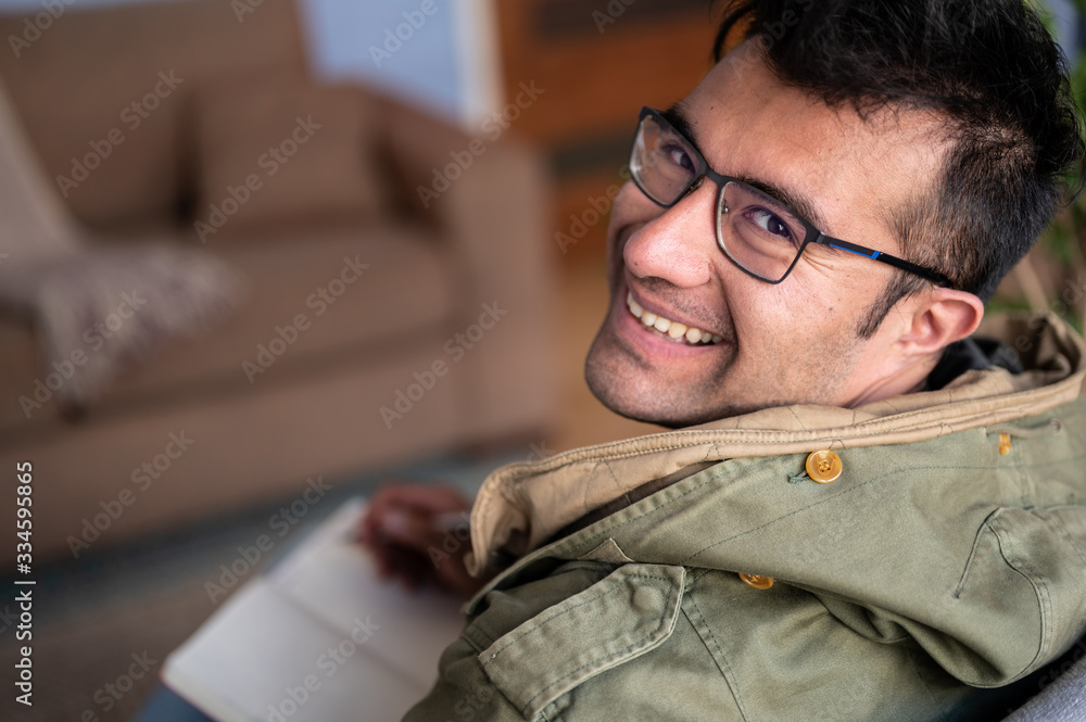 Fototapeta premium happy man with glasses writing