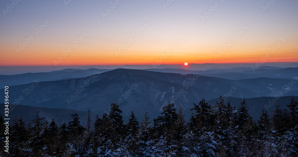 sunrise sun in winter in mountains, Czech Beskydy