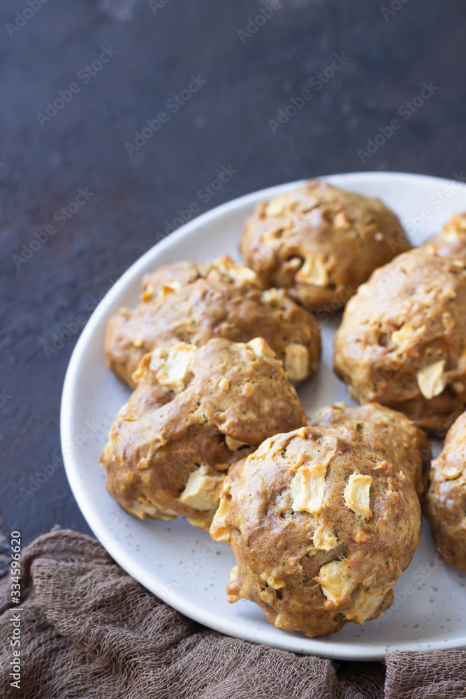 Soft and tender apple biscuits on a ceramic plate, dark concrete background. Dessert or breakfast for children, sweet snack. Selective focus. Soft and tender apple biscuits on a ceramic plate, dark concrete background. Dessert or breakfast for children, sweet snack. Selective focus.
