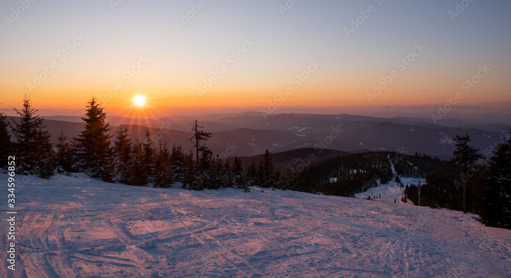 sunrise sun in winter in mountains, Czech Beskydy