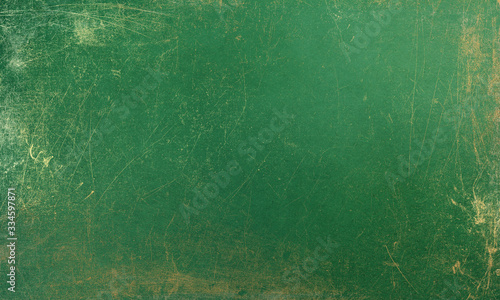 Abstract grunge jade green background with golden patina