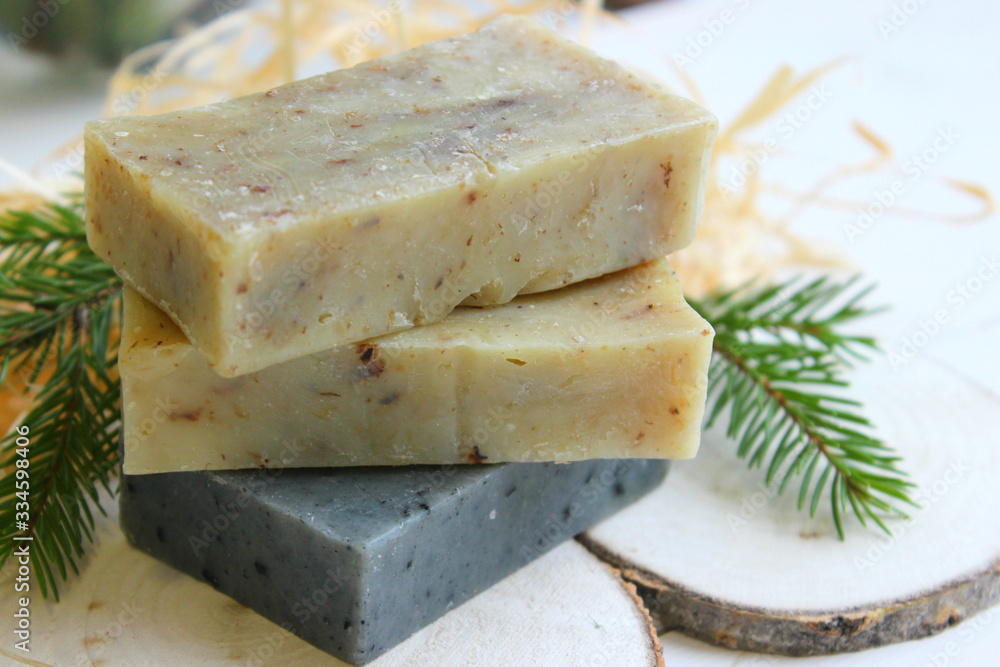 Natural handmade soap on a wooden background. Spa-natural treatments.Natural organic soap from scratch with pine aroma, essential oils. Natural handmade soap on a wooden background. Spa-natural treatments.Natural organic soap from scratch with pine aroma, essential oils.