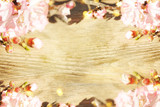 Blooming branches on the wooden background