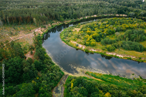 Aerial View Green Forest And River Landscape In Spring Evening. Top View Of Beautiful European Nature From High Attitude In Summer Season. Drone View. Bird's Eye View