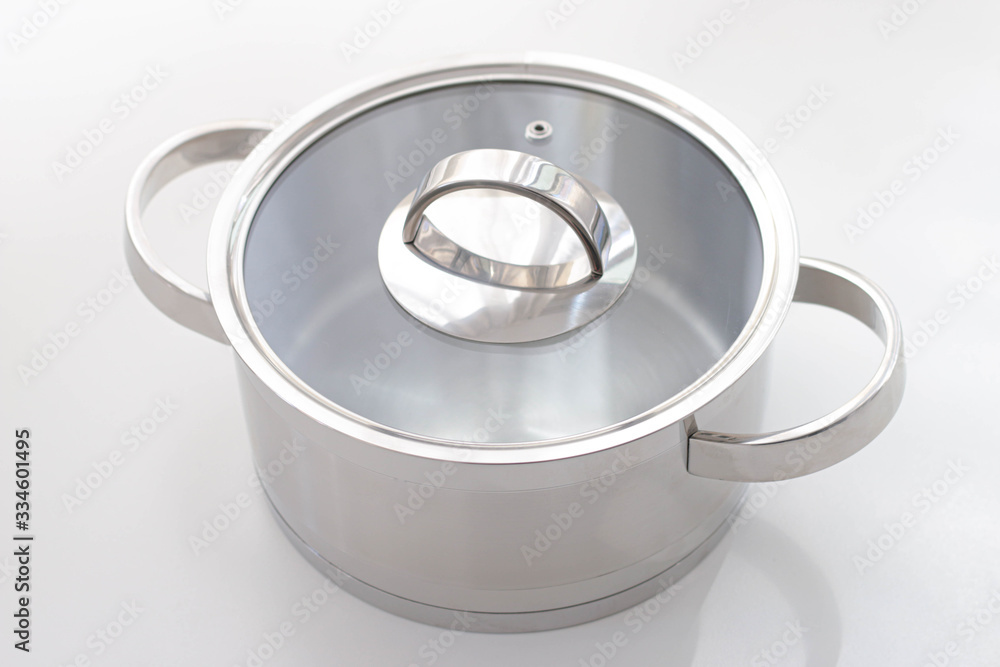Steel pot with a lid on a white background Steel pot with a lid on a white background