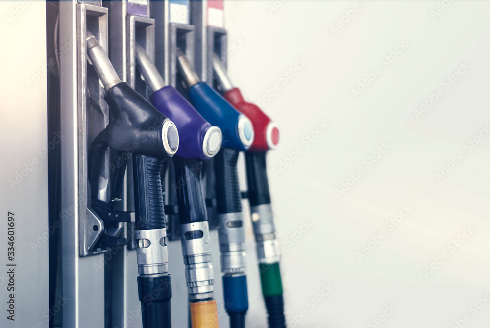 Gas station close-up with colored fuel hoses. Gas station close-up with colored fuel hoses.