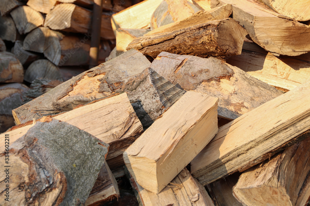 Sawing wood and preparing firewood for winter. Stacked pieces of wood on top of each other. Sawing wood and preparing firewood for winter. Stacked pieces of wood on top of each other.