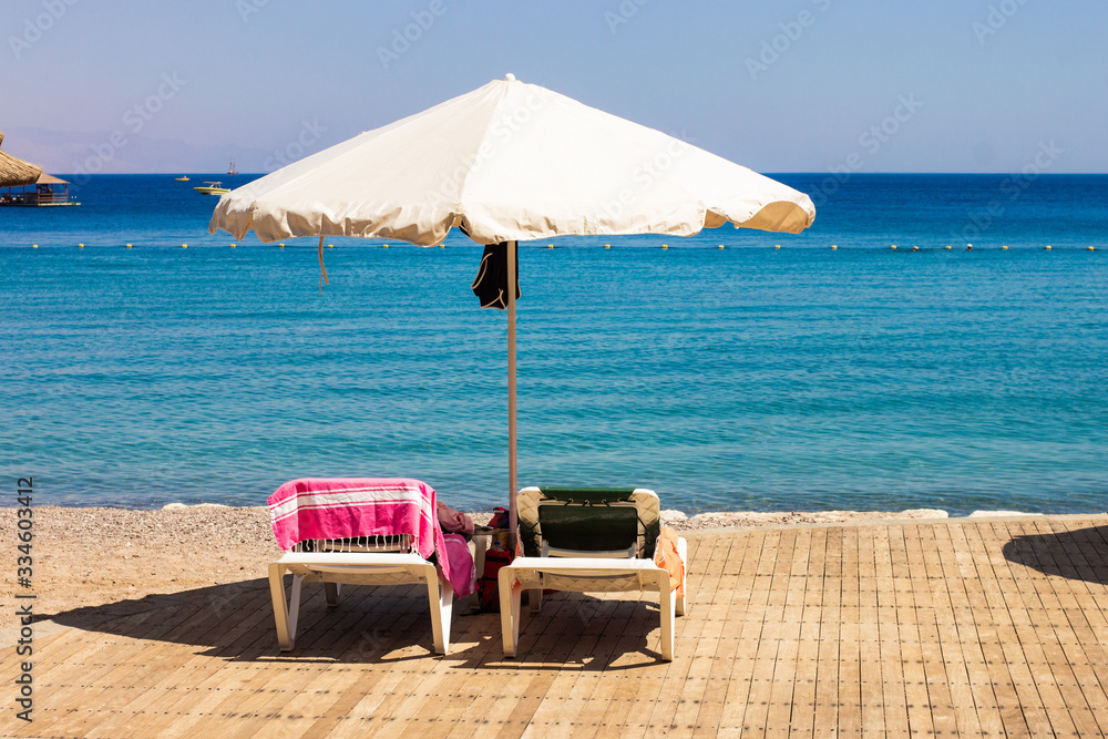 Φωτογραφία hotel resort area beach deck chair and umbrella lunge furniture summer time vaca