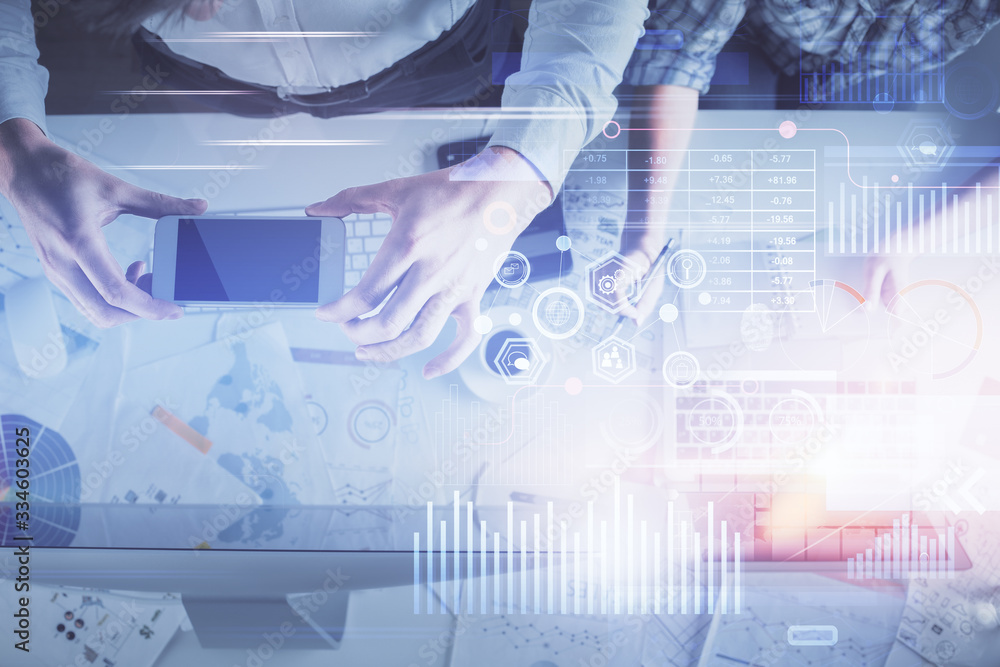 Double exposure of man and woman working together and data theme hologram drawing. Computer background. Top View. Double exposure of man and woman working together and data theme hologram drawing. Computer background. Top View.