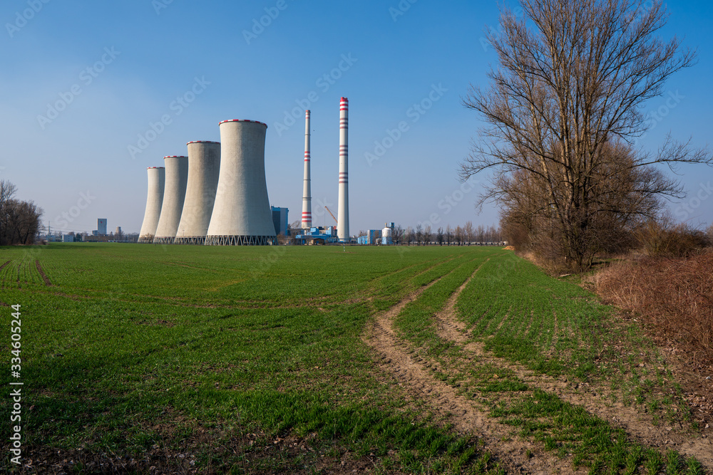 coal power plant with green field around, czech detmarovice 04.01.2020