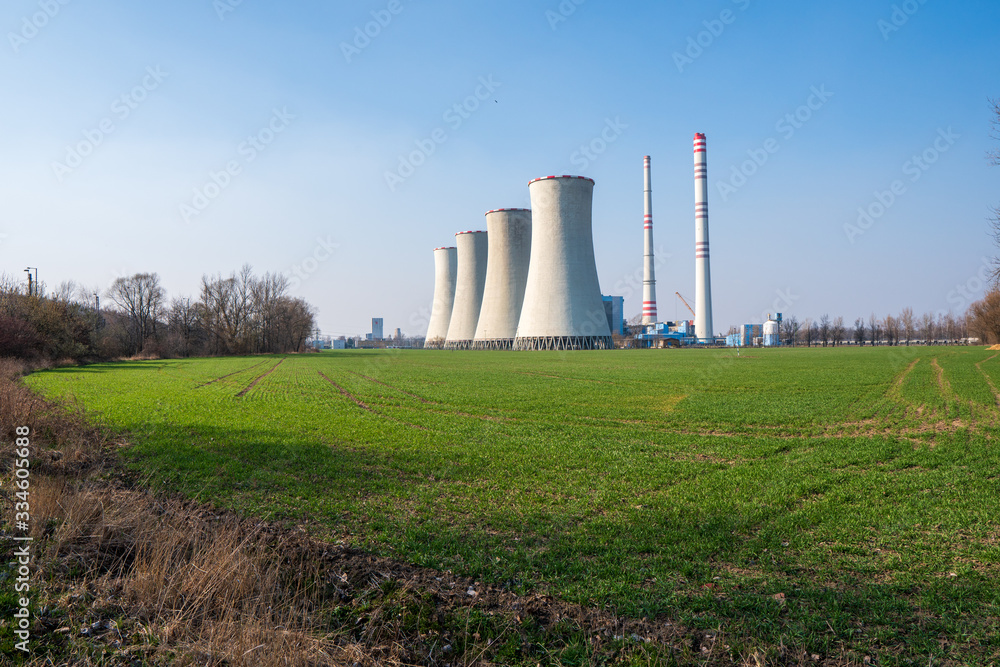 coal power plant with green field around, czech detmarovice 04.01.2020