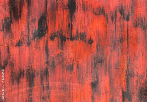 Black wall with strokes of red paint.