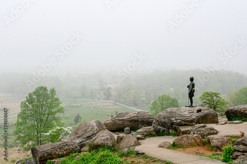  Little Round Top at Civil War battlefield with statue of General Warren, Gettysburg, Pennsylvania. photo