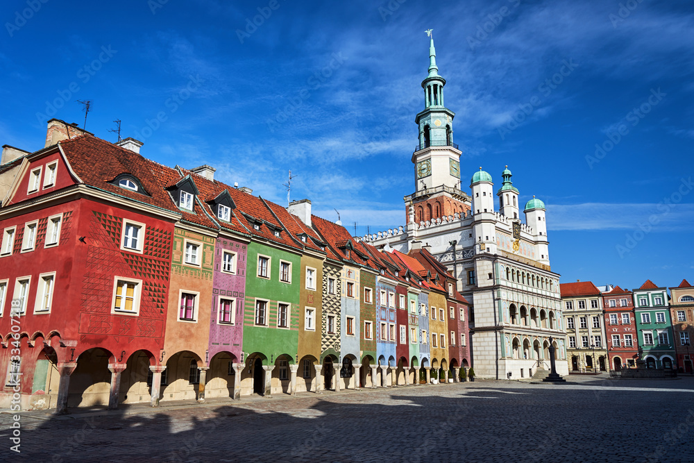 Old market with Renaissance town hall tower and historic tenements in Poznan..