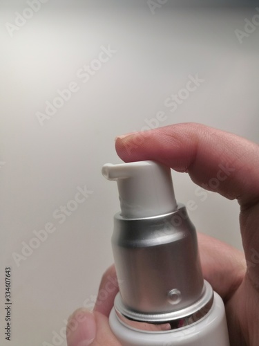 hand holding spray bottle