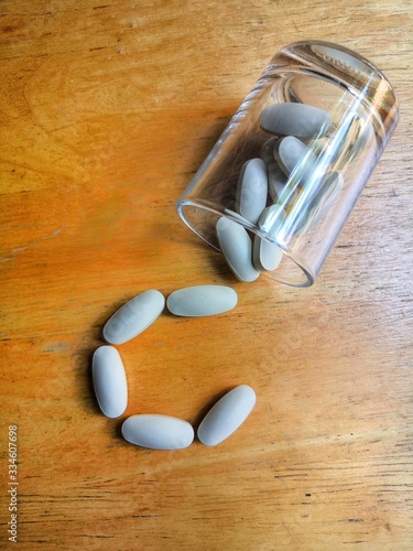 pills on a wooden table
