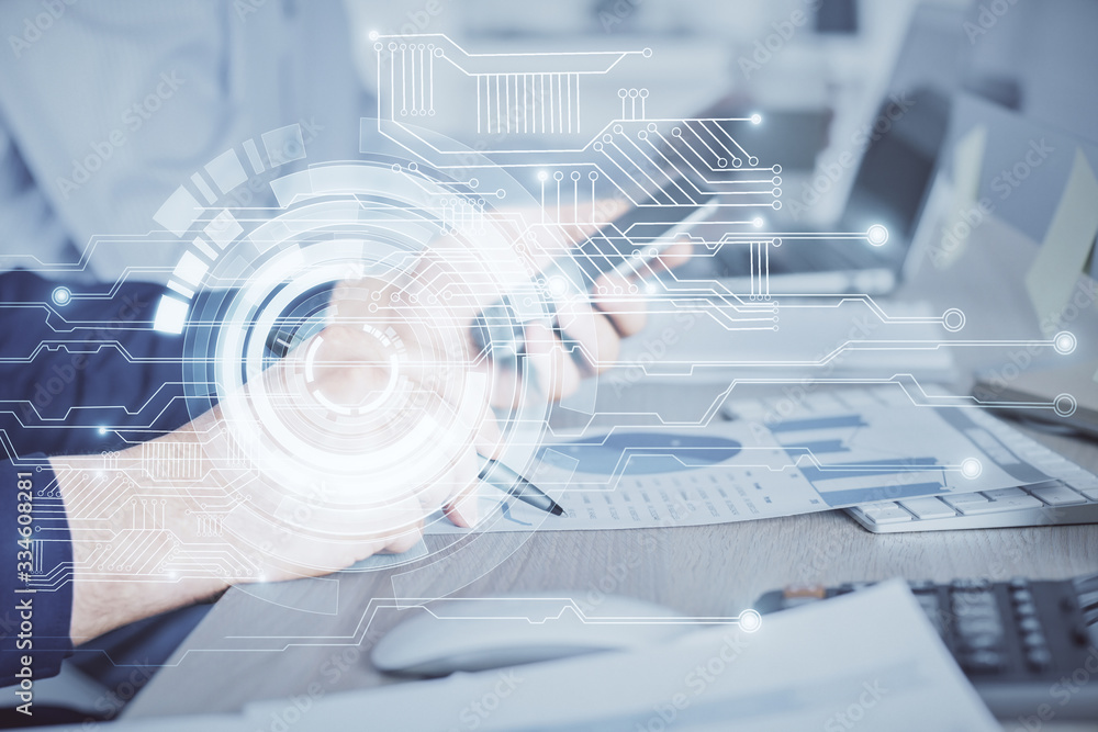 Double exposure of man's hand holding and using a digital device and data theme hologram drawing. Technology concept. Double exposure of man's hand holding and using a digital device and data theme hologram drawing. Technology concept.