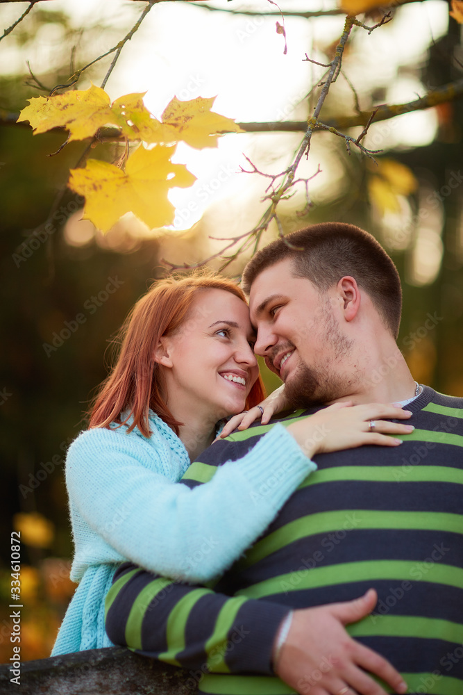 happy couple of lovers in the autumn forest happy couple of lovers in the autumn forest