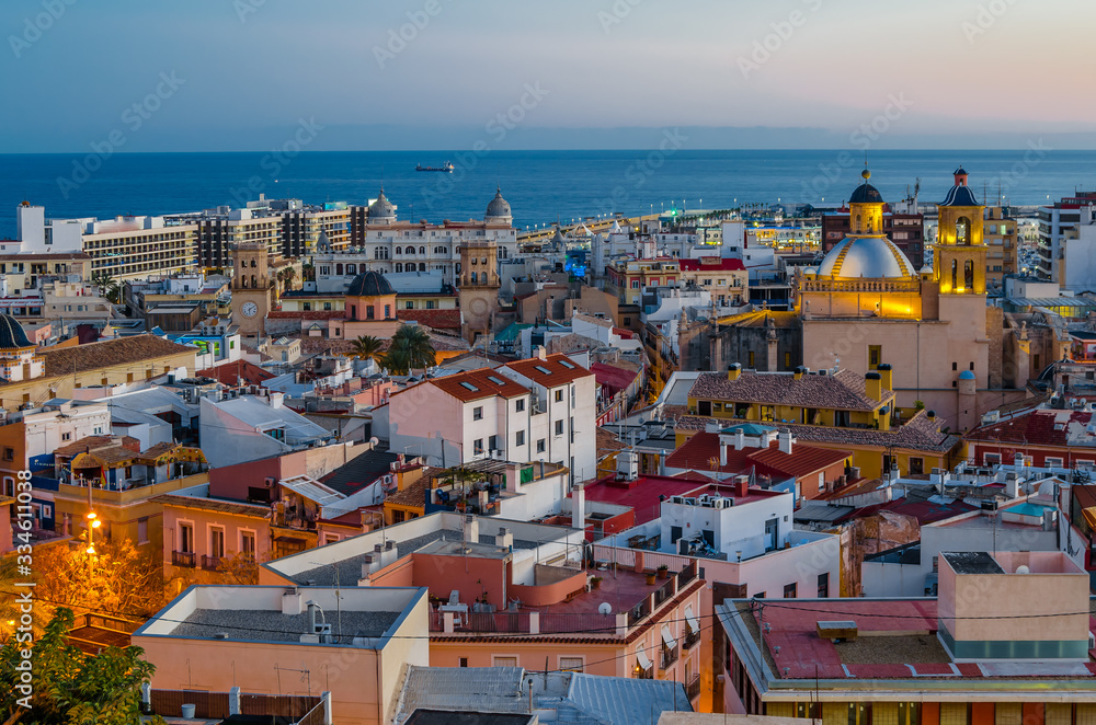 Alicante cityscape at dusk, showing the cathedral with the sea in the background