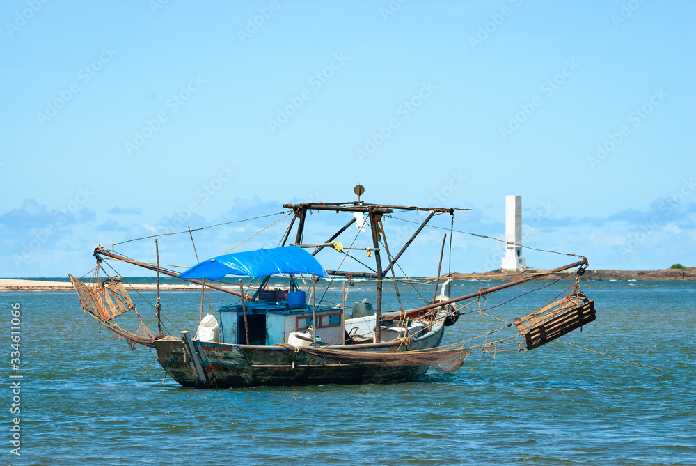 Obraz premium Itacare beach, Bahia, Brazil on February 23, 2008. Colorful fishing boat on Contas river