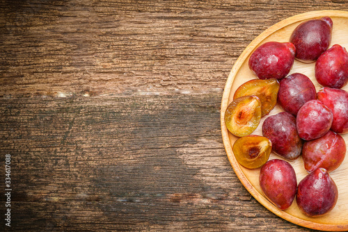 Fresh Prunes on a wooden background, Fresh Plums on the wooden table