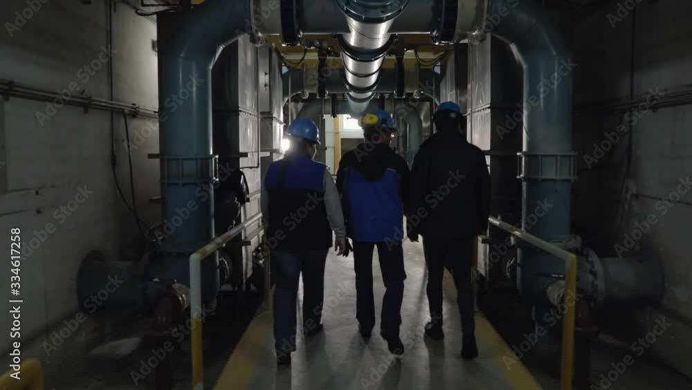 Workers on water treatment facility Workers on water treatment facility
