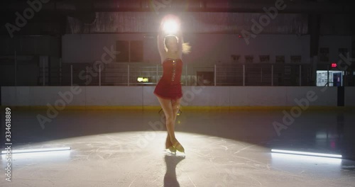 Girl figure skater performing routine