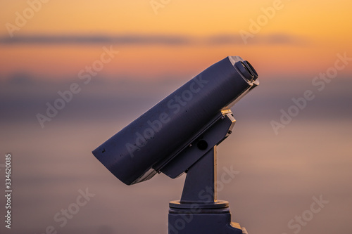 Fototapeta Naklejka Na Ścianę i Meble -  Binoculars for tourists on the background of the sunset