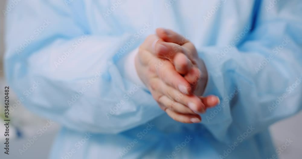 Covid-19 Coronavirus - Doctor is Desinfecting Hands with Germicidal Gel Covid-19 Coronavirus - Doctor is Desinfecting Hands with Germicidal Gel