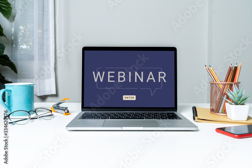Work From Home with laptop computer for online training webinars. E-learning browsing connection and cloud online technology webcast concept. Laptop mockup with clipping path on screen.