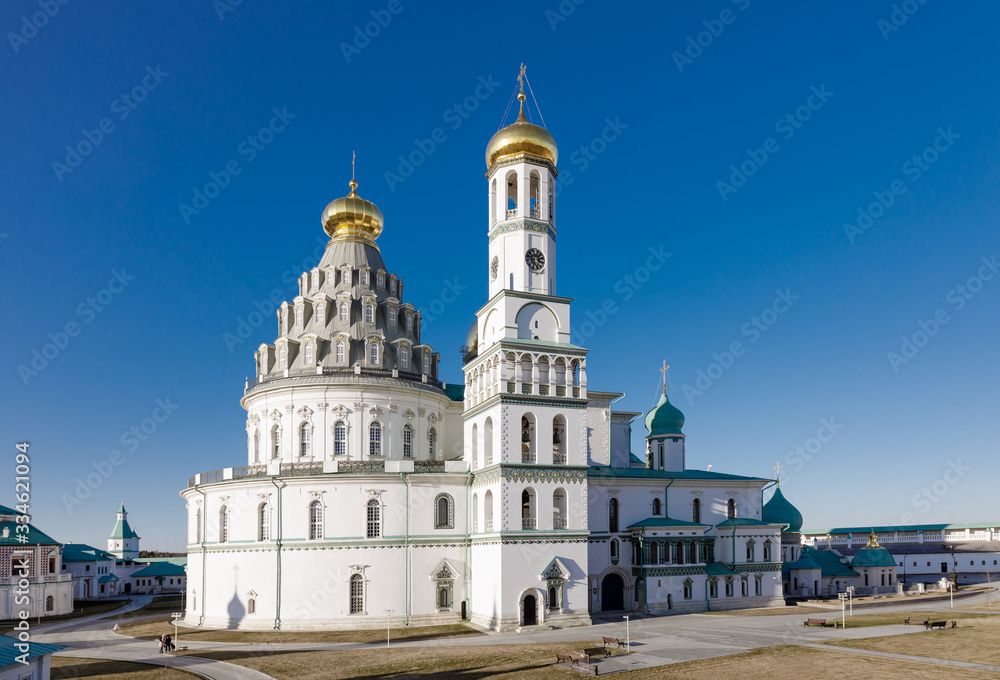 Temple of white stone with golden domes, the Cathedral of the New Jerusalem Monastery, Russia, Istra.