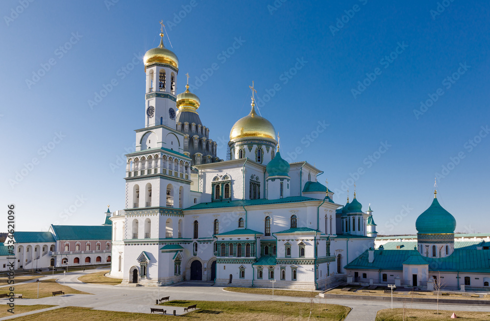 Temple of white stone with golden domes, the Cathedral of the New Jerusalem Monastery, Russia, Istra.