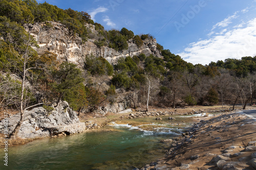 River and rock formations with blue sky background