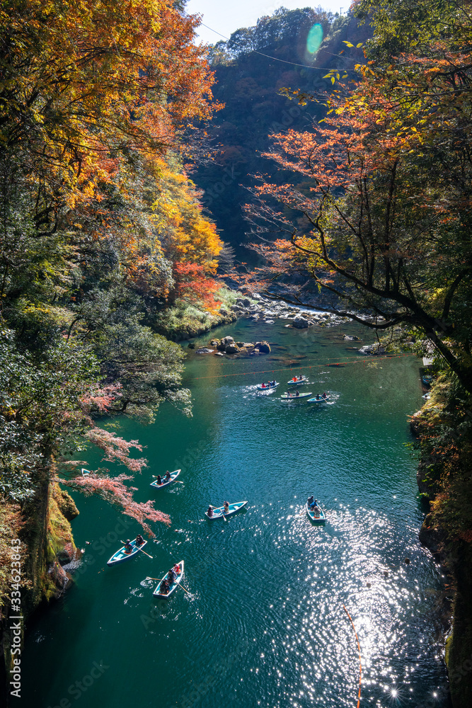 Takachiho Gorge, Miyazaki, Japan. November 16, 2019 : It's known where a trail follows the Gokase River, also accessible by boat, past Manai Falls. Takachiho Gorge, Miyazaki, Japan. November 16, 2019 : It's known where a trail follows the Gokase River, also accessible by boat, past Manai Falls.
