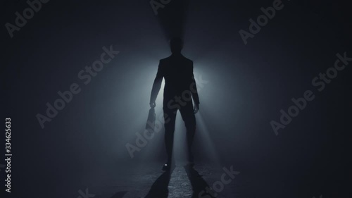 A man walking with a briefcase